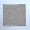 Strickmuster in Naturweiß für Sarner Wolle mit klassischer Perlstrick-Textur